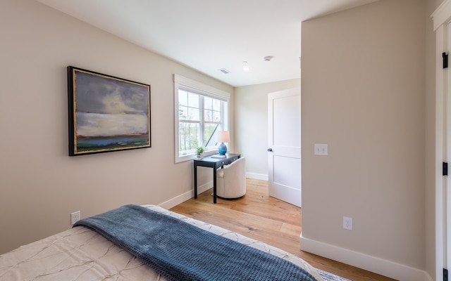 60 White Oaks Rd Unit 26, Laconia, NH 03246 - bedroom with light wood-style floors and baseboards
