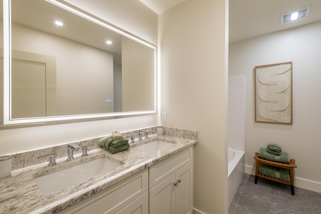 60 White Oaks Rd Unit 26, Laconia, NH 03246 - full bath featuring double vanity, a bathtub, baseboards, and recessed lighting