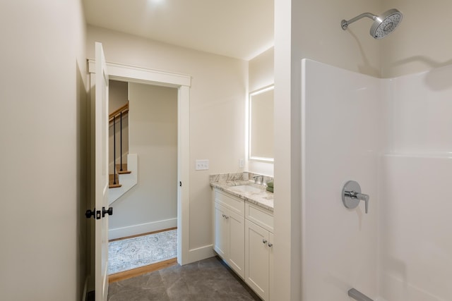 60 White Oaks Rd Unit 26, Laconia, NH 03246 - bathroom with vanity, a shower, and baseboards