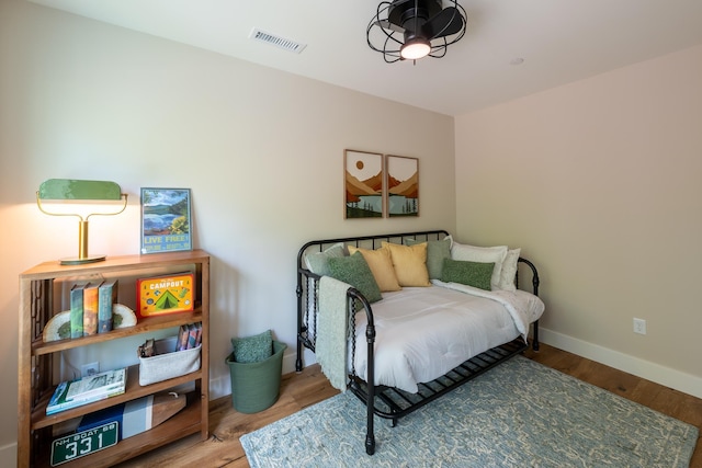 60 White Oaks Rd Unit 26, Laconia, NH 03246 - bedroom featuring baseboards and wood finished floors