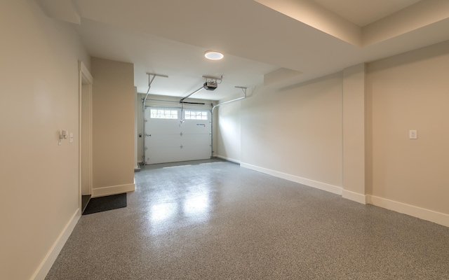 60 White Oaks Rd Unit 26, Laconia, NH 03246 - garage with a garage door opener and baseboards