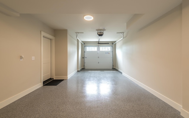 60 White Oaks Rd Unit 26, Laconia, NH 03246 - garage with a garage door opener and baseboards