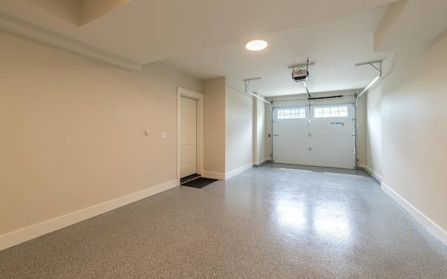 60 White Oaks Rd Unit 26, Laconia, NH 03246 - garage with a garage door opener and baseboards