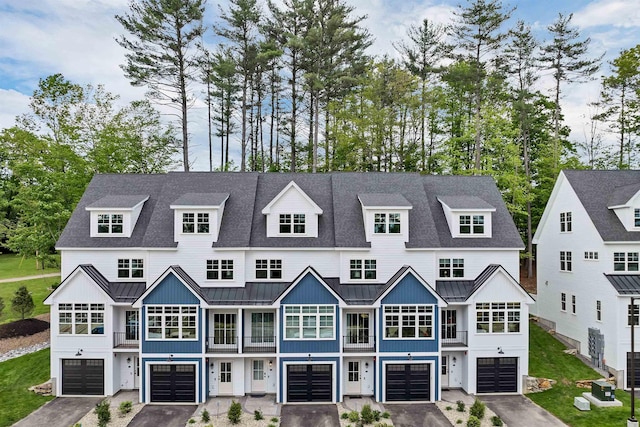 60 White Oaks Rd Unit 26, Laconia, NH 03246 - view of front of house with a standing seam roof, a balcony, and metal roof