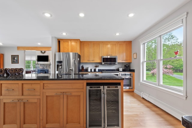 345 Williams Rd, Littleton, NH 03561 - kitchen featuring wine cooler, appliances with stainless steel finishes, a baseboard heating unit, healthy amount of natural light, and recessed lighting