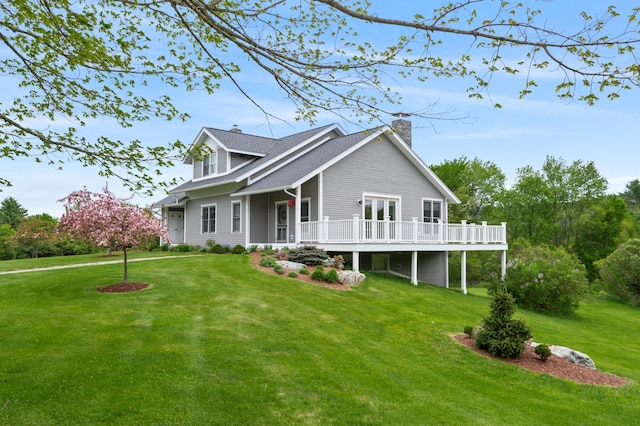345 Williams Rd, Littleton, NH 03561 - view of front of home featuring a chimney, a front lawn, and a deck