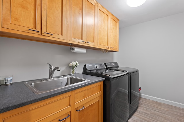 345 Williams Rd, Littleton, NH 03561 - laundry room featuring washing machine and clothes dryer, cabinet space, light wood-type flooring, and baseboards