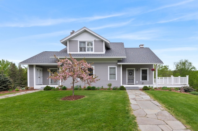345 Williams Rd, Littleton, NH 03561 - view of front of house featuring a porch, a chimney, and a shingled roof