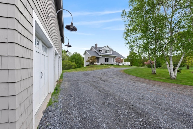 345 Williams Rd, Littleton, NH 03561 - view of dirt / gravel driveway with street lighting