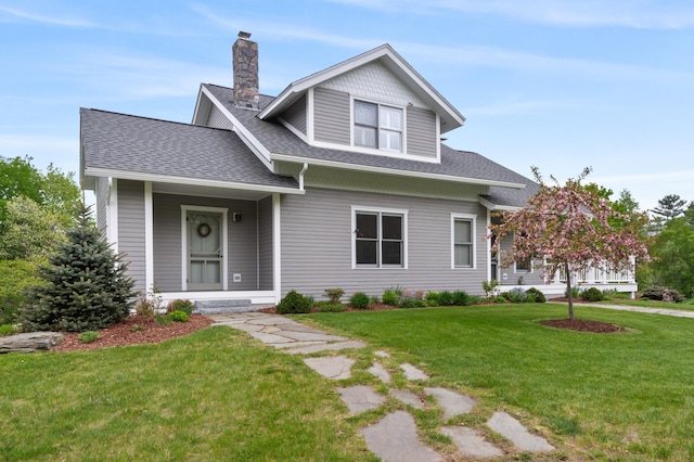 345 Williams Rd, Littleton, NH 03561 - view of front facade featuring a chimney, roof with shingles, and a front yard