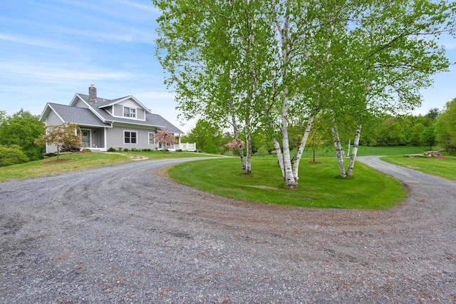 345 Williams Rd, Littleton, NH 03561 - view of front facade featuring a chimney, driveway, and a front yard