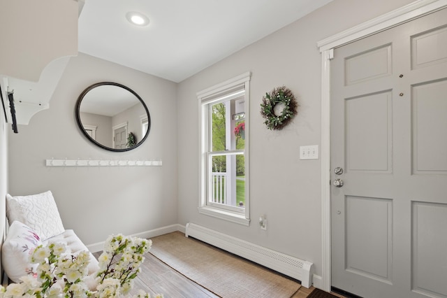 345 Williams Rd, Littleton, NH 03561 - entrance foyer with a baseboard heating unit, baseboards, wood finished floors, and recessed lighting