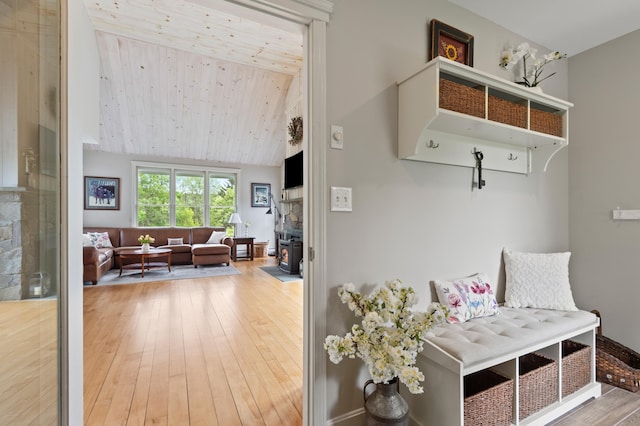 345 Williams Rd, Littleton, NH 03561 - mudroom featuring hardwood / wood-style flooring, wood ceiling, a wood stove, and high vaulted ceiling
