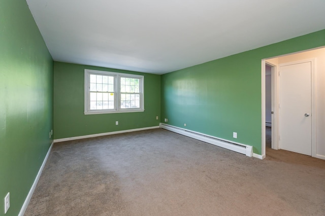101 E Broadway Rd Unit 1, Derry, NH 03038 - carpeted empty room featuring a baseboard radiator and baseboards