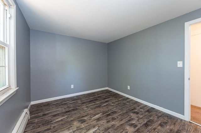 101 E Broadway Rd Unit 1, Derry, NH 03038 - unfurnished room featuring a baseboard heating unit, dark wood-type flooring, and baseboards