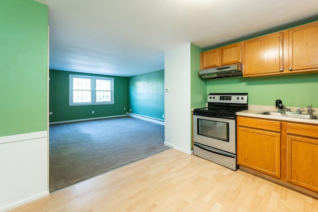 101 E Broadway Rd Unit 1, Derry, NH 03038 - kitchen with stainless steel range with electric stovetop, under cabinet range hood, a baseboard heating unit, light wood-type flooring, and open floor plan