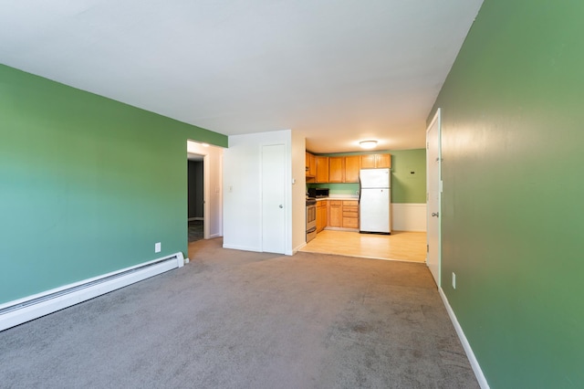 101 E Broadway Rd Unit 1, Derry, NH 03038 - unfurnished living room with a baseboard radiator, light colored carpet, and baseboards