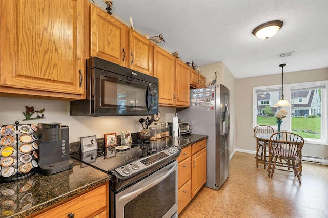 51 Cardinal Dr Unit B, Laconia, NH 03246 - kitchen with appliances with stainless steel finishes, baseboards, hanging light fixtures, dark stone counters, and a textured ceiling
