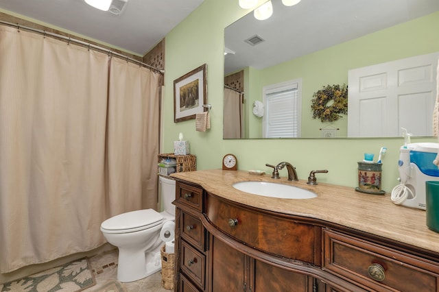 51 Cardinal Dr Unit B, Laconia, NH 03246 - bathroom with vanity, toilet, and a shower with curtain