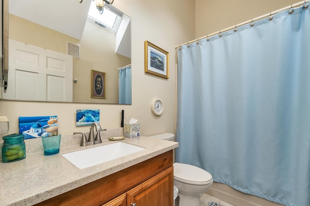 51 Cardinal Dr Unit B, Laconia, NH 03246 - bathroom featuring toilet, vanity, and a skylight
