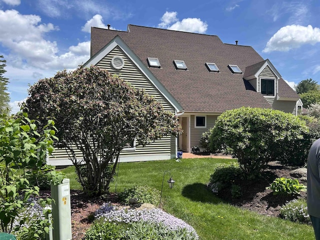 51 Cardinal Dr Unit B, Laconia, NH 03246 - view of front of house featuring a front lawn and roof with shingles