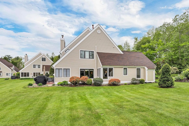 51 Cardinal Dr Unit B, Laconia, NH 03246 - rear view of house featuring a yard and a chimney