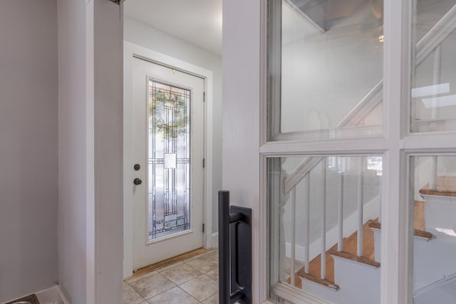 12 Harvard St, Exeter, NH 03862 - entrance foyer featuring light tile patterned floors and stairs