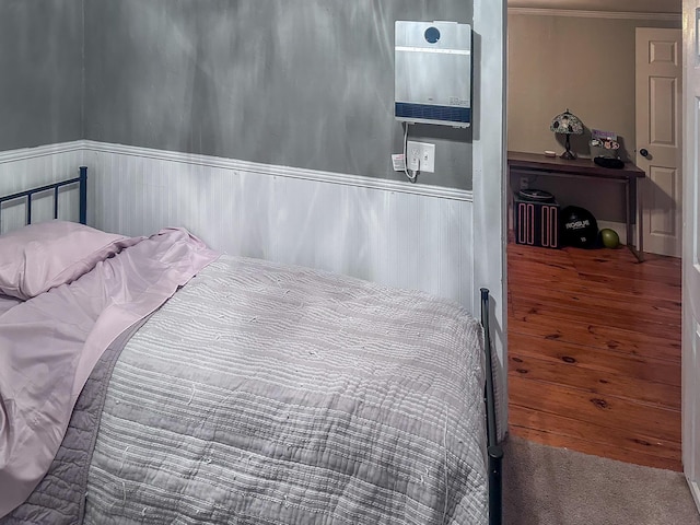 12 Harvard St, Exeter, NH 03862 - bedroom featuring a wainscoted wall, ornamental molding, and carpet