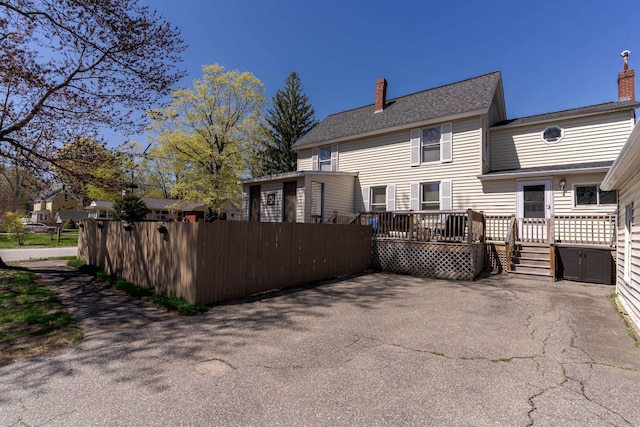 12 Harvard St, Exeter, NH 03862 - back of house with a deck and a chimney