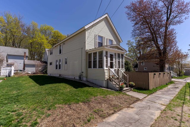 12 Harvard St, Exeter, NH 03862 - view of property exterior with a sunroom