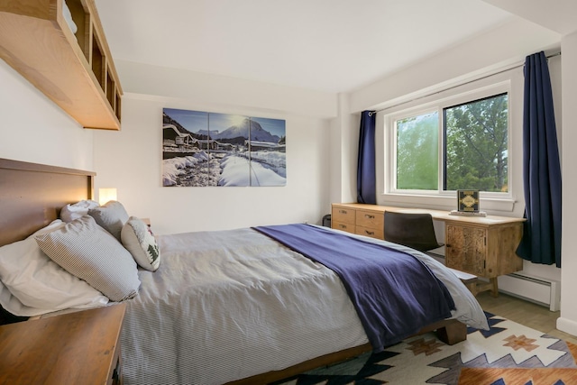 137 E Mountain Rd Unit 2E1, Killington, VT 05751 - bedroom featuring baseboard heating and light wood-style flooring