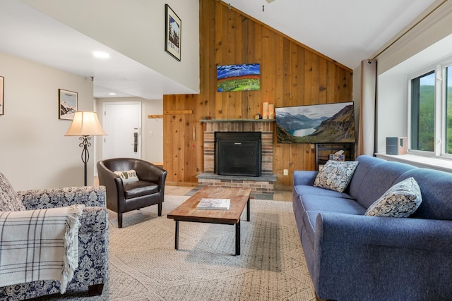 137 E Mountain Rd Unit 2E1, Killington, VT 05751 - living room featuring wooden walls, recessed lighting, a brick fireplace, and high vaulted ceiling