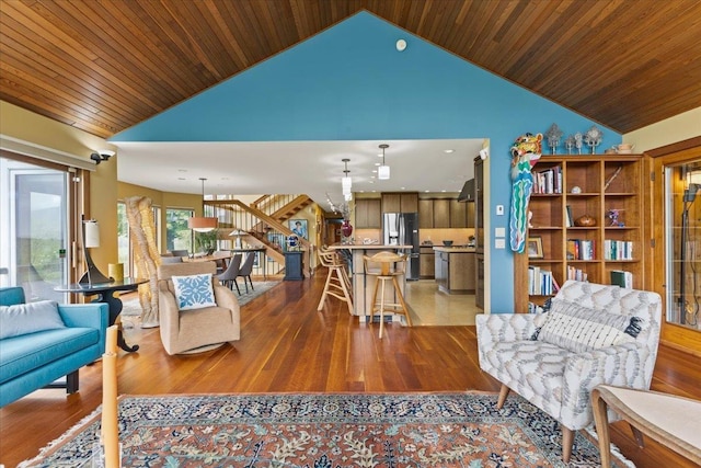 83 Dewey Farm Rd, Stowe, VT 05672 - living area with stairs, wood finished floors, wooden ceiling, recessed lighting, and high vaulted ceiling