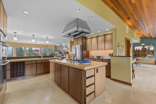 83 Dewey Farm Rd, Stowe, VT 05672 - kitchen with stainless steel appliances, island exhaust hood, wooden ceiling, a sink, and decorative light fixtures
