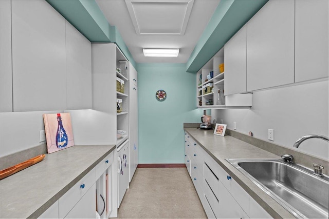 83 Dewey Farm Rd, Stowe, VT 05672 - kitchen with open shelves, a sink, white cabinets, light countertops, and baseboards