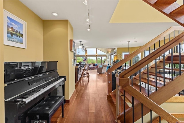 83 Dewey Farm Rd, Stowe, VT 05672 - stairs with wood-type flooring, recessed lighting, baseboards, and rail lighting