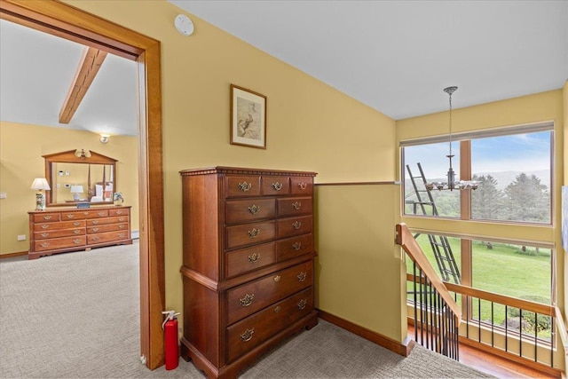 83 Dewey Farm Rd, Stowe, VT 05672 - bedroom with a chandelier, baseboards, and carpet