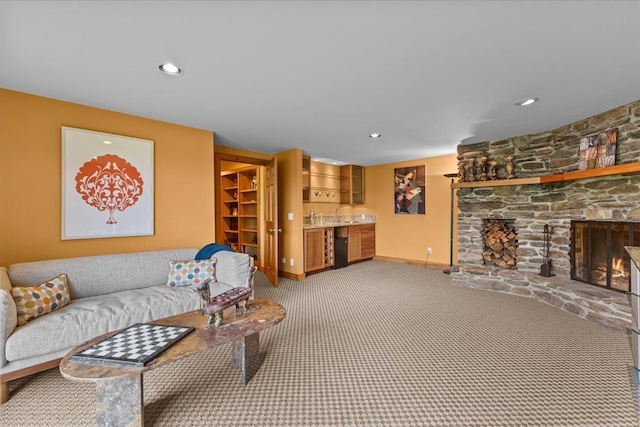 83 Dewey Farm Rd, Stowe, VT 05672 - living area featuring bar area, baseboards, light carpet, a stone fireplace, and recessed lighting