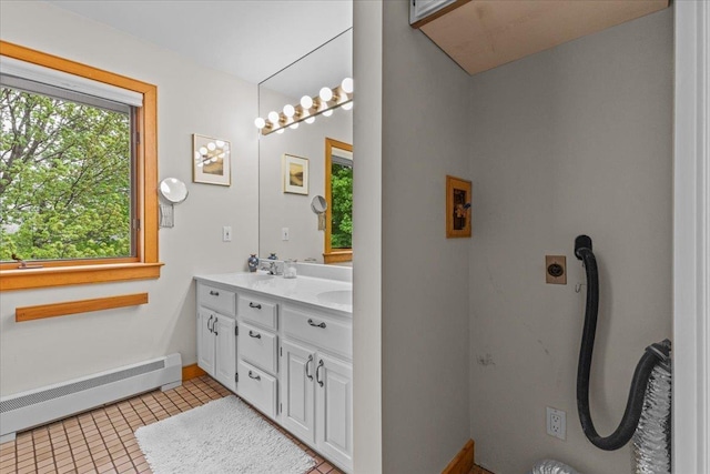 83 Dewey Farm Rd, Stowe, VT 05672 - full bathroom featuring a baseboard radiator, double vanity, and tile patterned floors