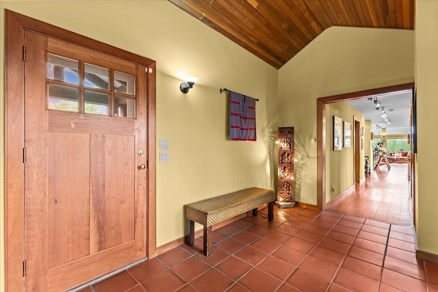 83 Dewey Farm Rd, Stowe, VT 05672 - entrance foyer featuring wooden ceiling, dark tile patterned flooring, lofted ceiling, baseboards, and rail lighting