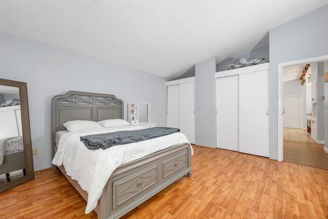 4 Johns Dr Unit A, Hooksett, NH 03106 - bedroom with lofted ceiling, light wood-style floors, and two closets