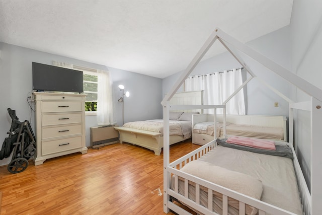4 Johns Dr Unit A, Hooksett, NH 03106 - bedroom with light wood-style floors and lofted ceiling