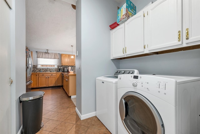 4 Johns Dr Unit A, Hooksett, NH 03106 - laundry room with washer and dryer, cabinet space, light tile patterned floors, and baseboards