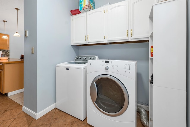 4 Johns Dr Unit A, Hooksett, NH 03106 - laundry room featuring washer and dryer, light tile patterned flooring, cabinet space, and baseboards