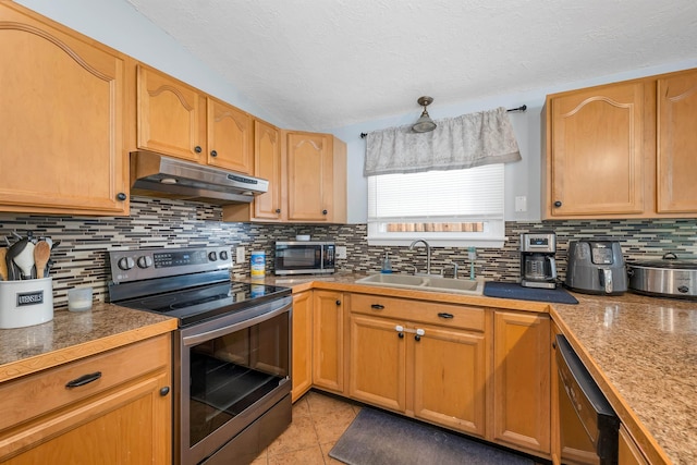 4 Johns Dr Unit A, Hooksett, NH 03106 - kitchen featuring under cabinet range hood, stainless steel appliances, a sink, tasteful backsplash, and a textured ceiling