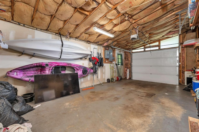 4 Johns Dr Unit A, Hooksett, NH 03106 - garage featuring a garage door opener and electric panel