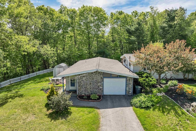 4 Johns Dr Unit A, Hooksett, NH 03106 - view of front of home with stone siding, an attached garage, and asphalt driveway