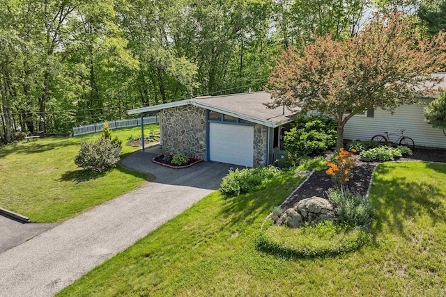 4 Johns Dr Unit A, Hooksett, NH 03106 - view of front of home featuring stone siding, driveway, and an attached garage