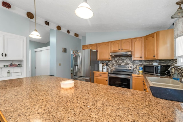 4 Johns Dr Unit A, Hooksett, NH 03106 - kitchen featuring appliances with stainless steel finishes, vaulted ceiling, under cabinet range hood, tasteful backsplash, and a sink
