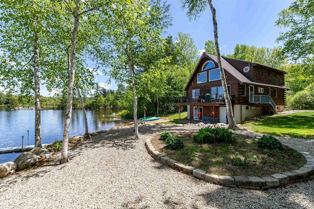 72 Auclair Rd, Middleton, NH 03887 - view of side of home featuring log siding, a deck with water view, and a yard